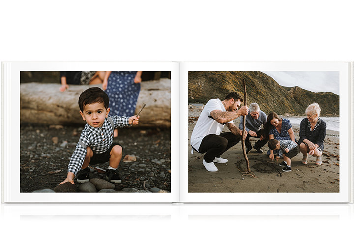 Open photo book showing images of family at beach