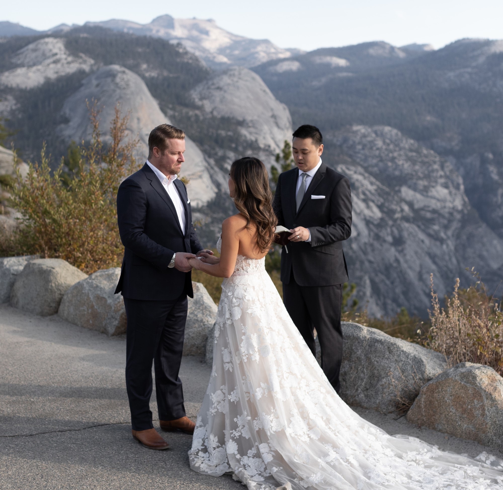 Bride, groom and officiant in small wedding ceremony