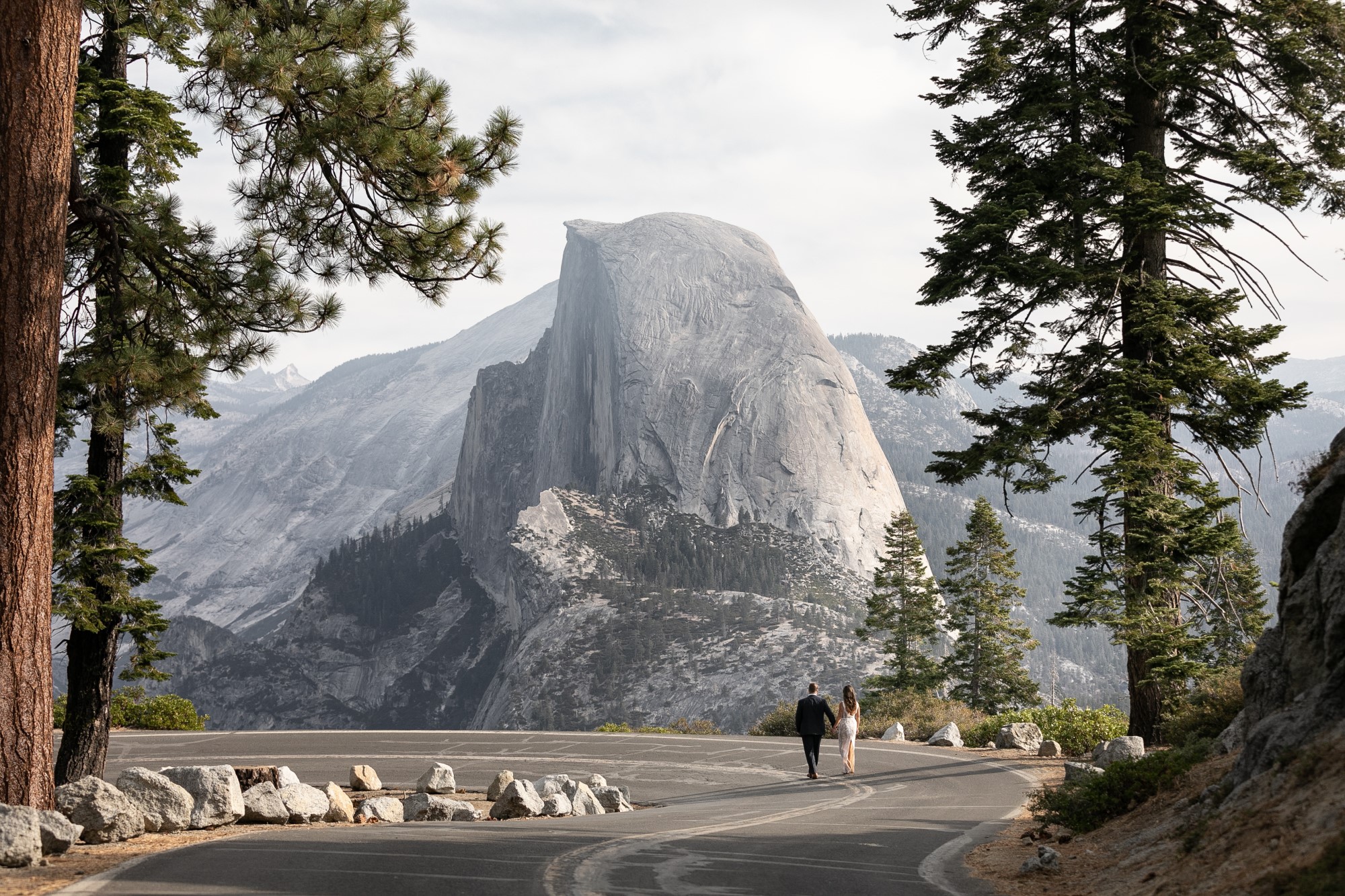 Newlyweds walk hand-in-hand in Yosemite National Park