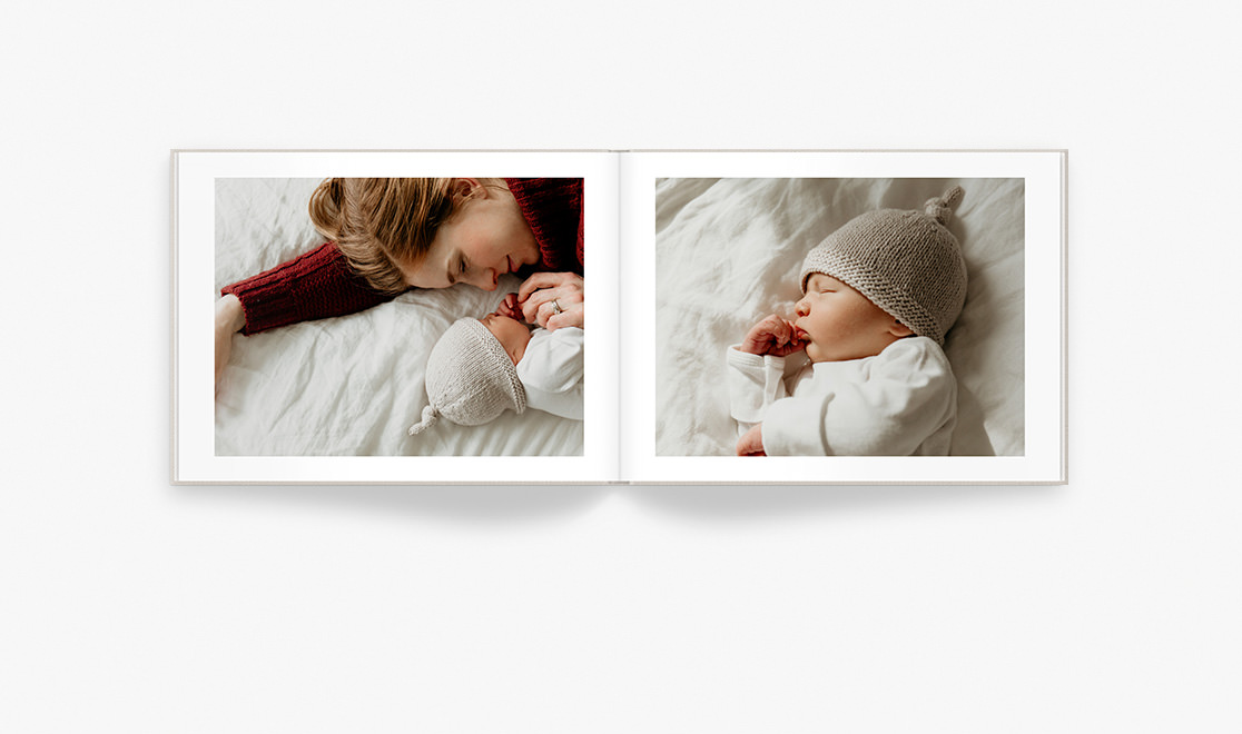 Open photo book with photos of mum and her newborn son