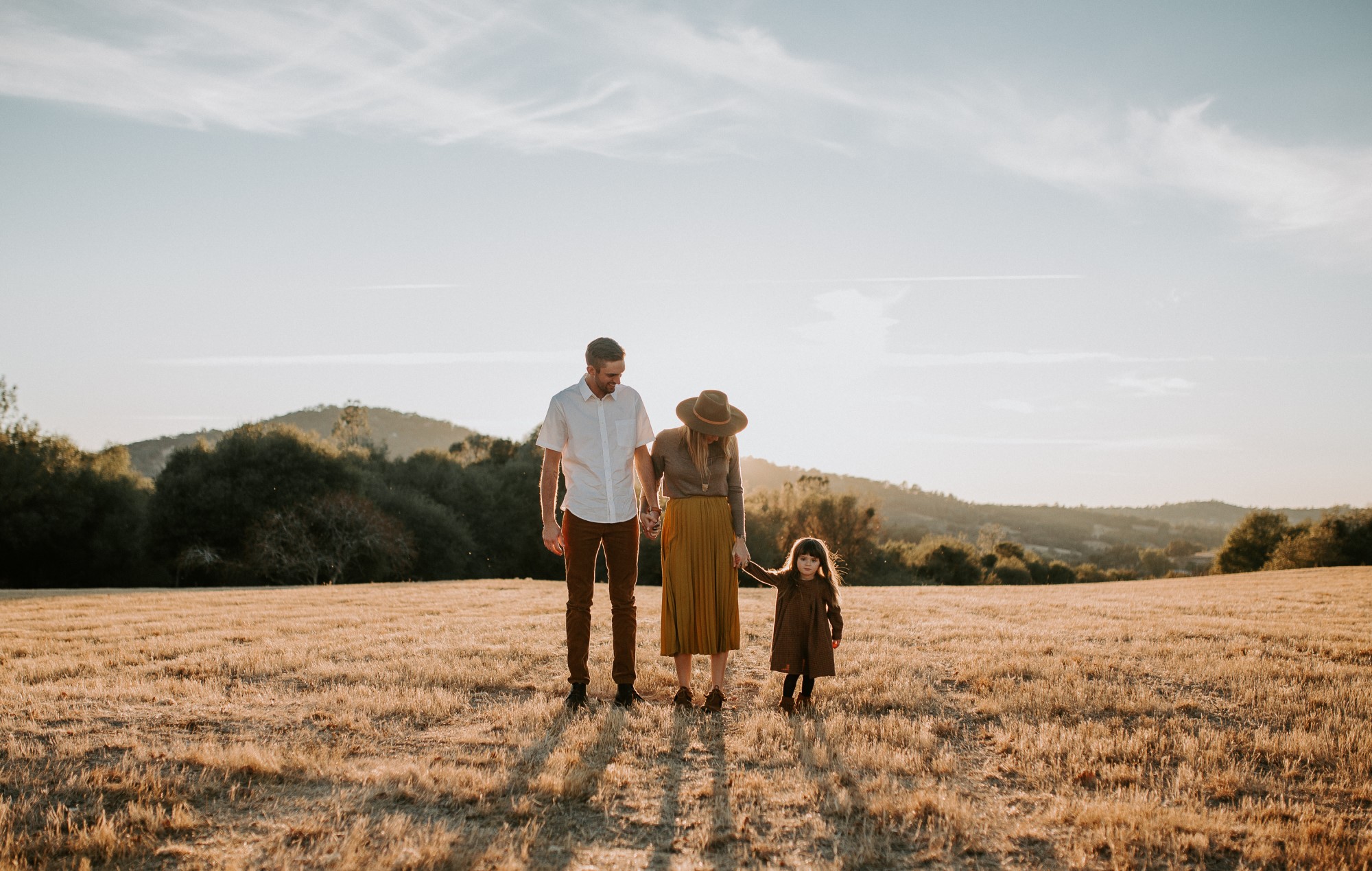 Family in field at golden hour