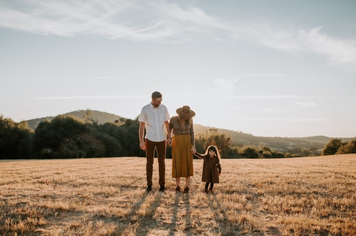 Family in a field at golden hour