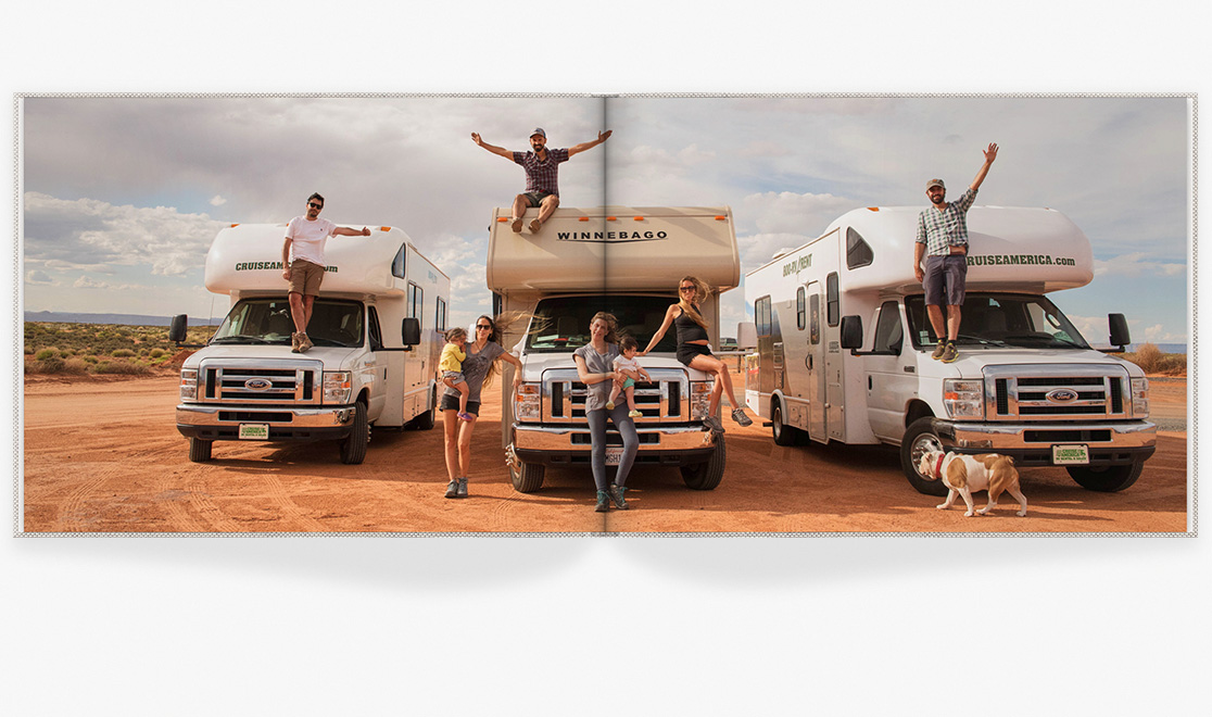 Photo book spread showing travel image with motorhomes