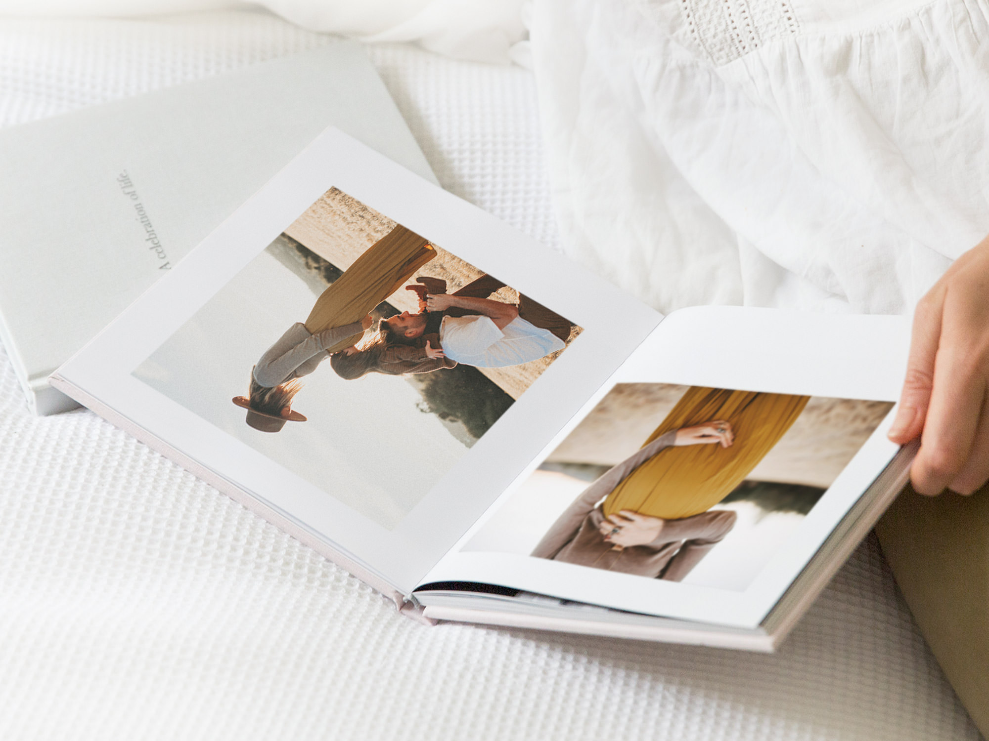 Open premium photo book with maternity images