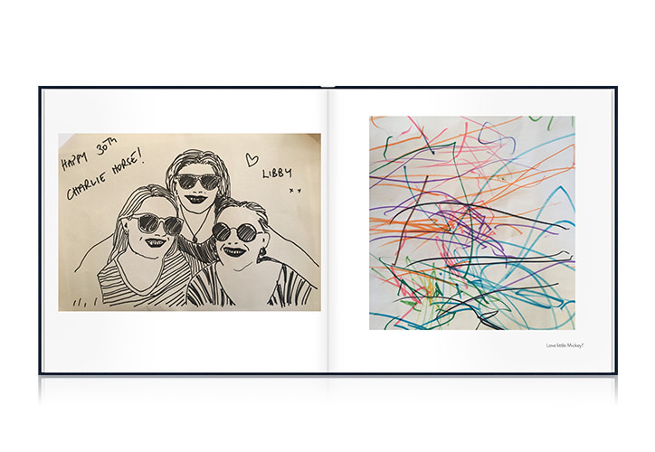 Open Square Photo Book showing spread of scanned drawings