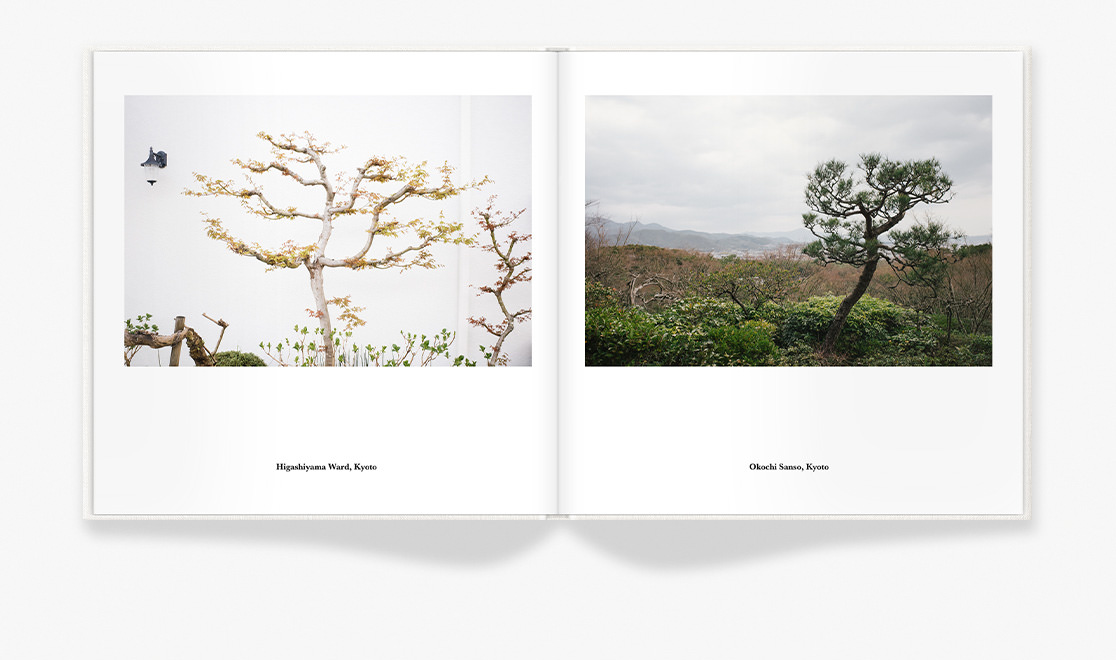 Photo book spread showing travel photos in Kyoto