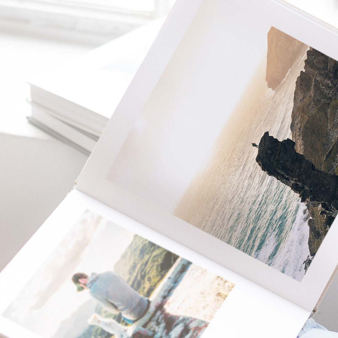 Open book showing spread of travel photos