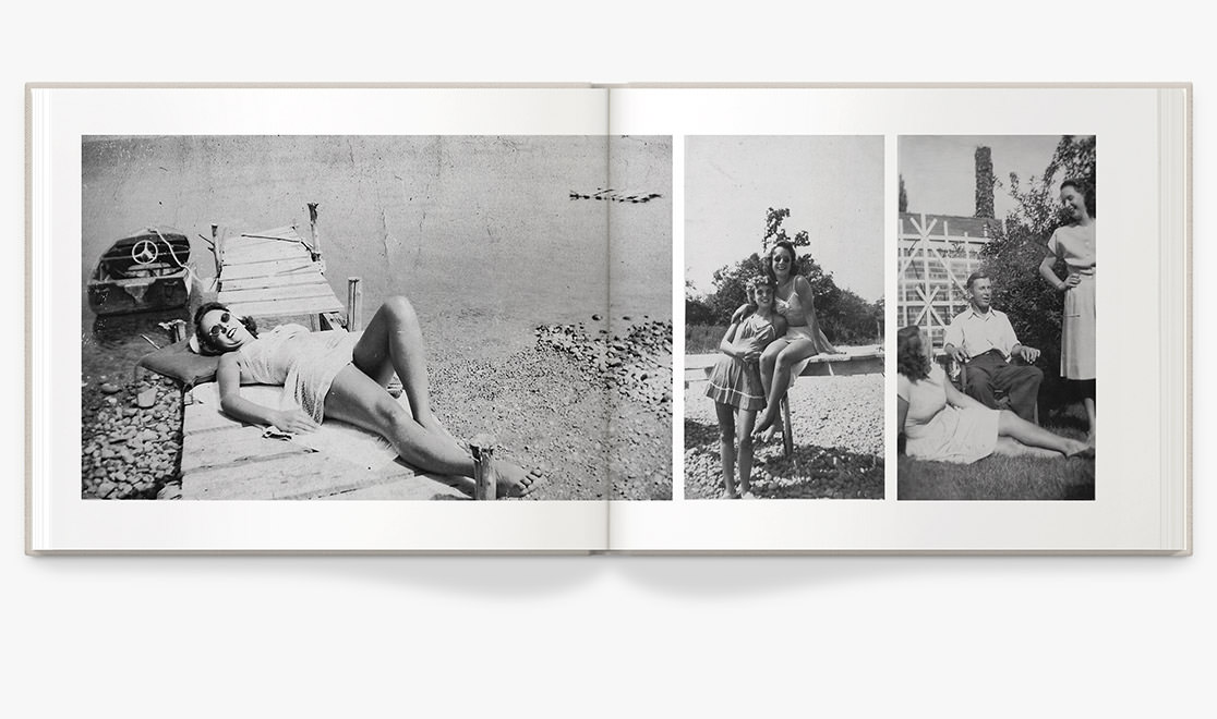 Photo book spread displaying old black and white photos