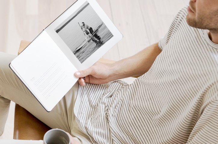 Man looking at photo book