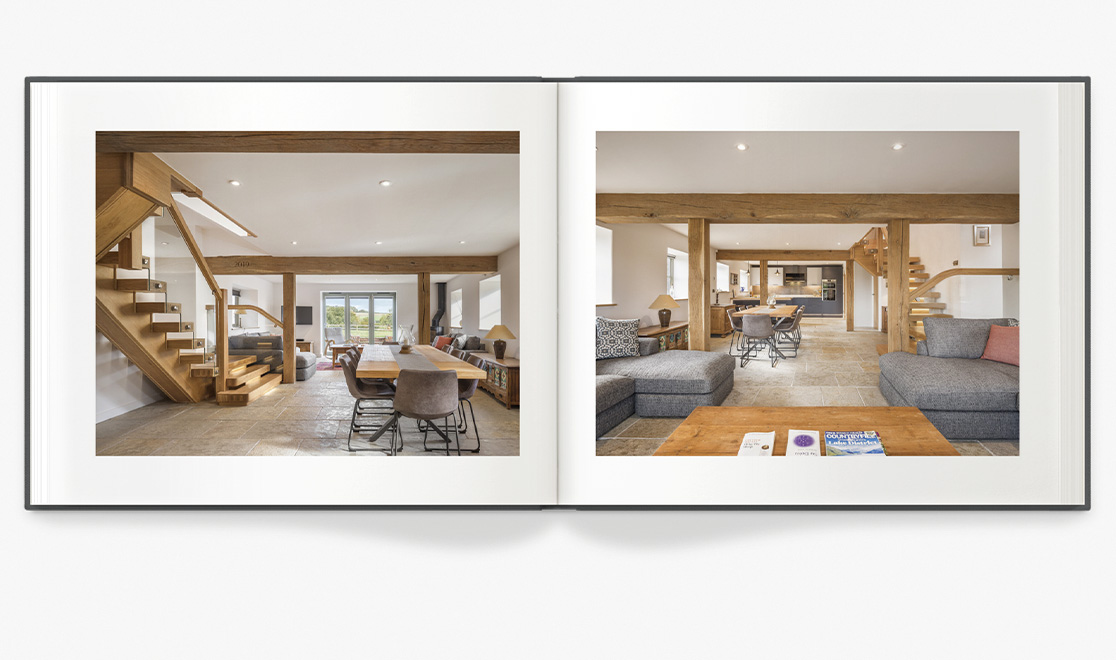 Open photo book showing spread of photos of new home