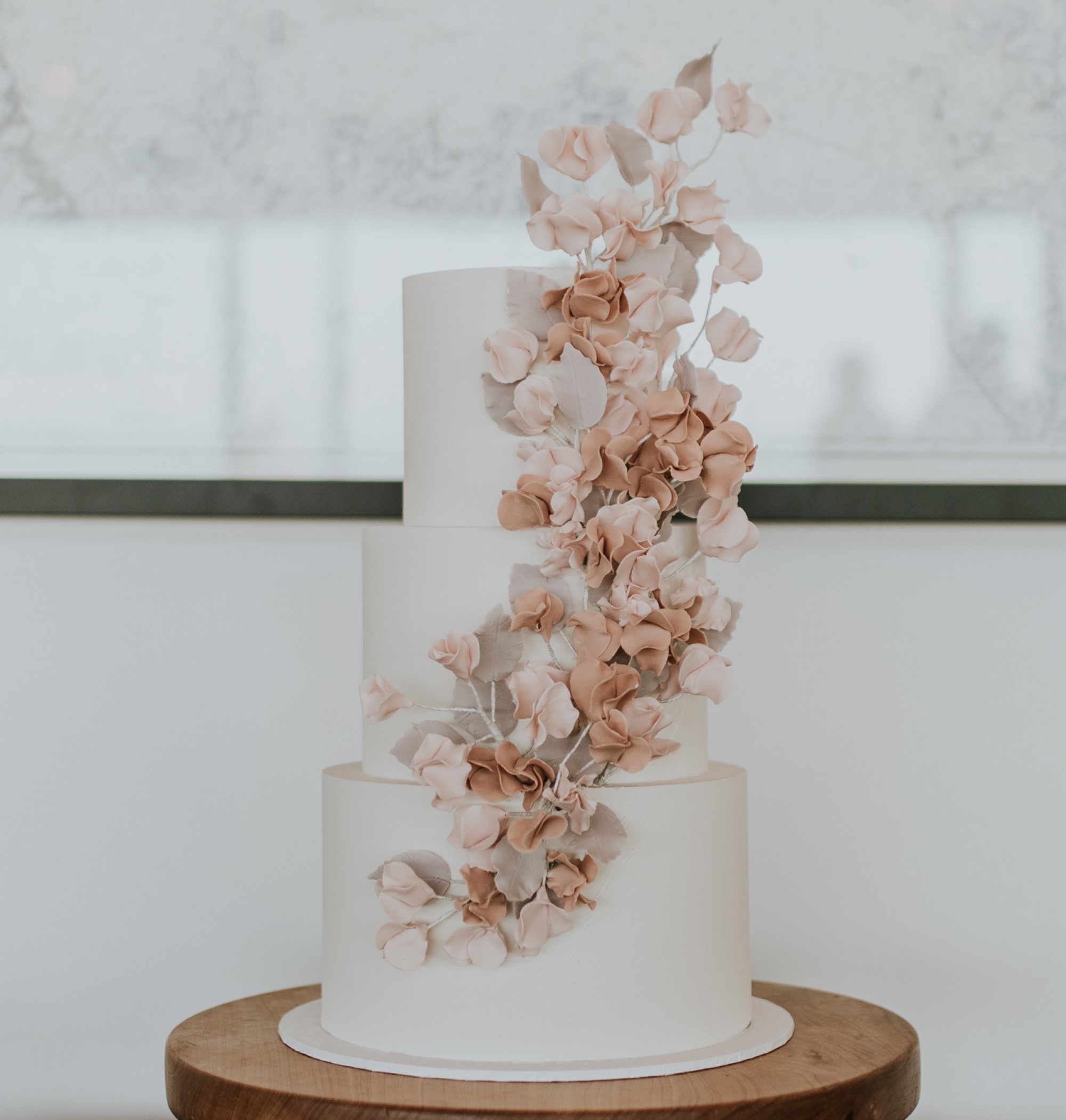 Triple tiered white wedding cake
