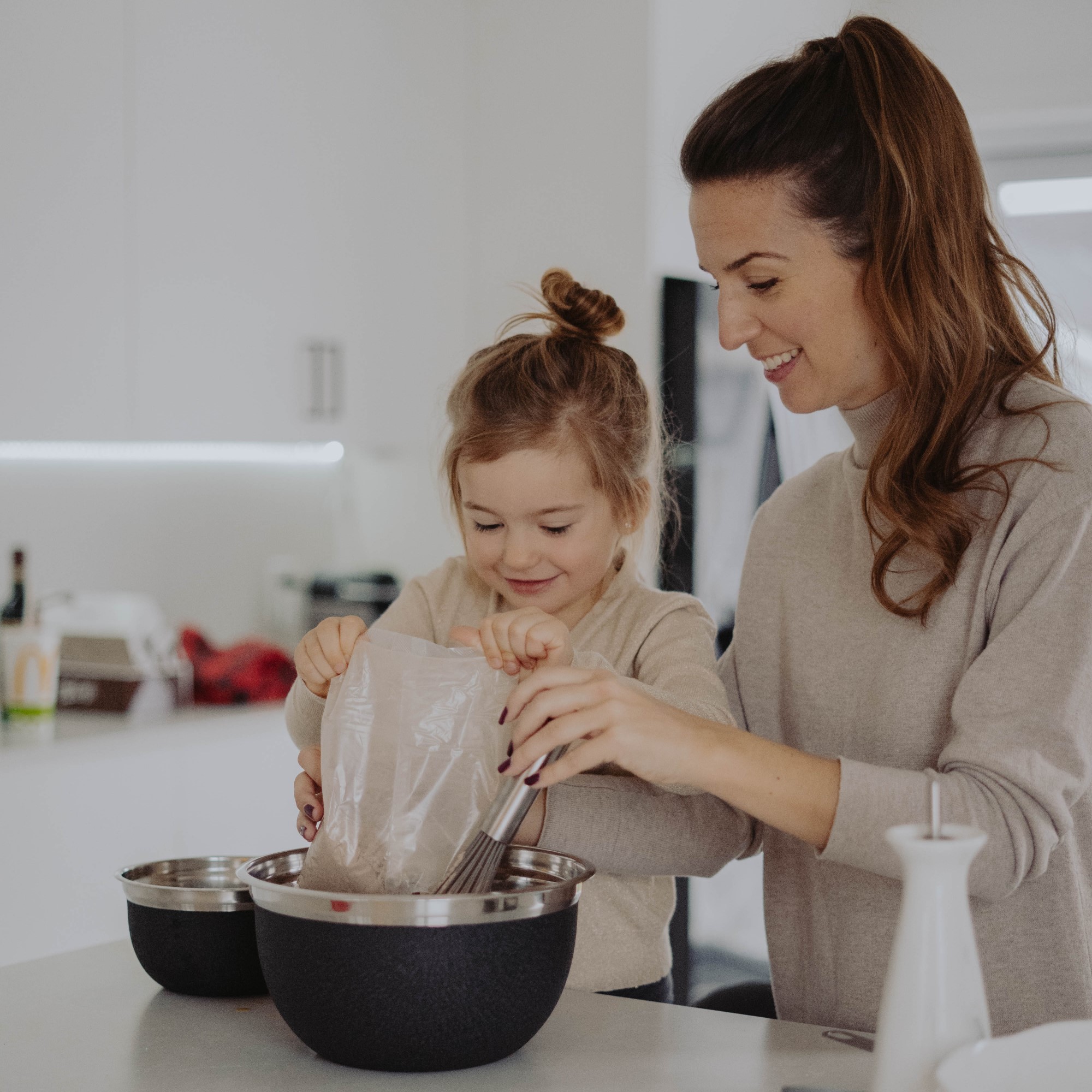 Woman and child baking together