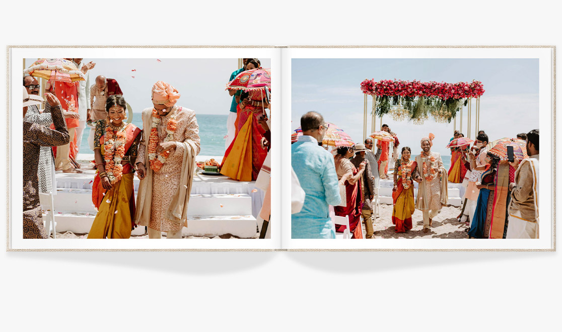 Open photo book showing spread of wedding images