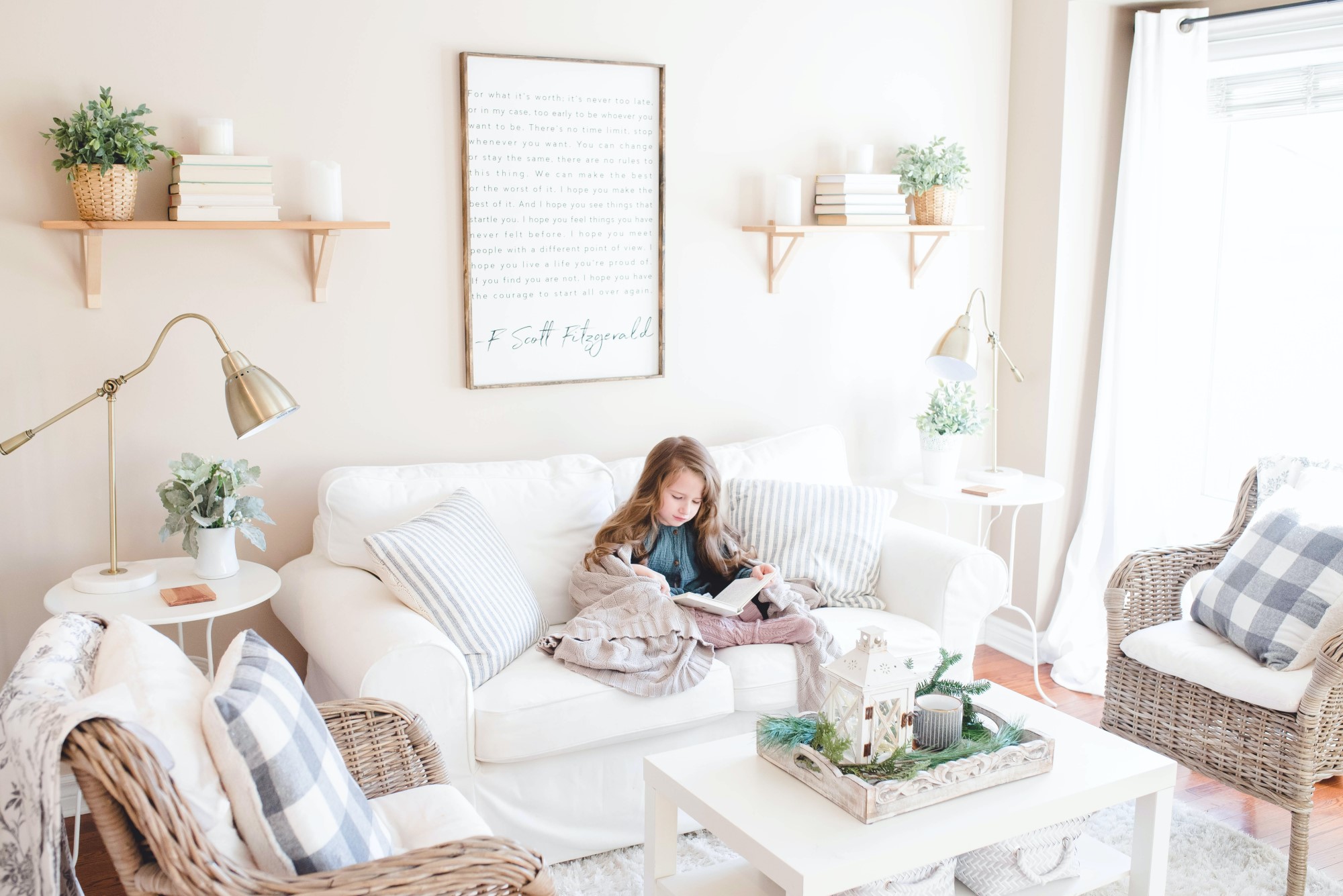Young girl reading on couch