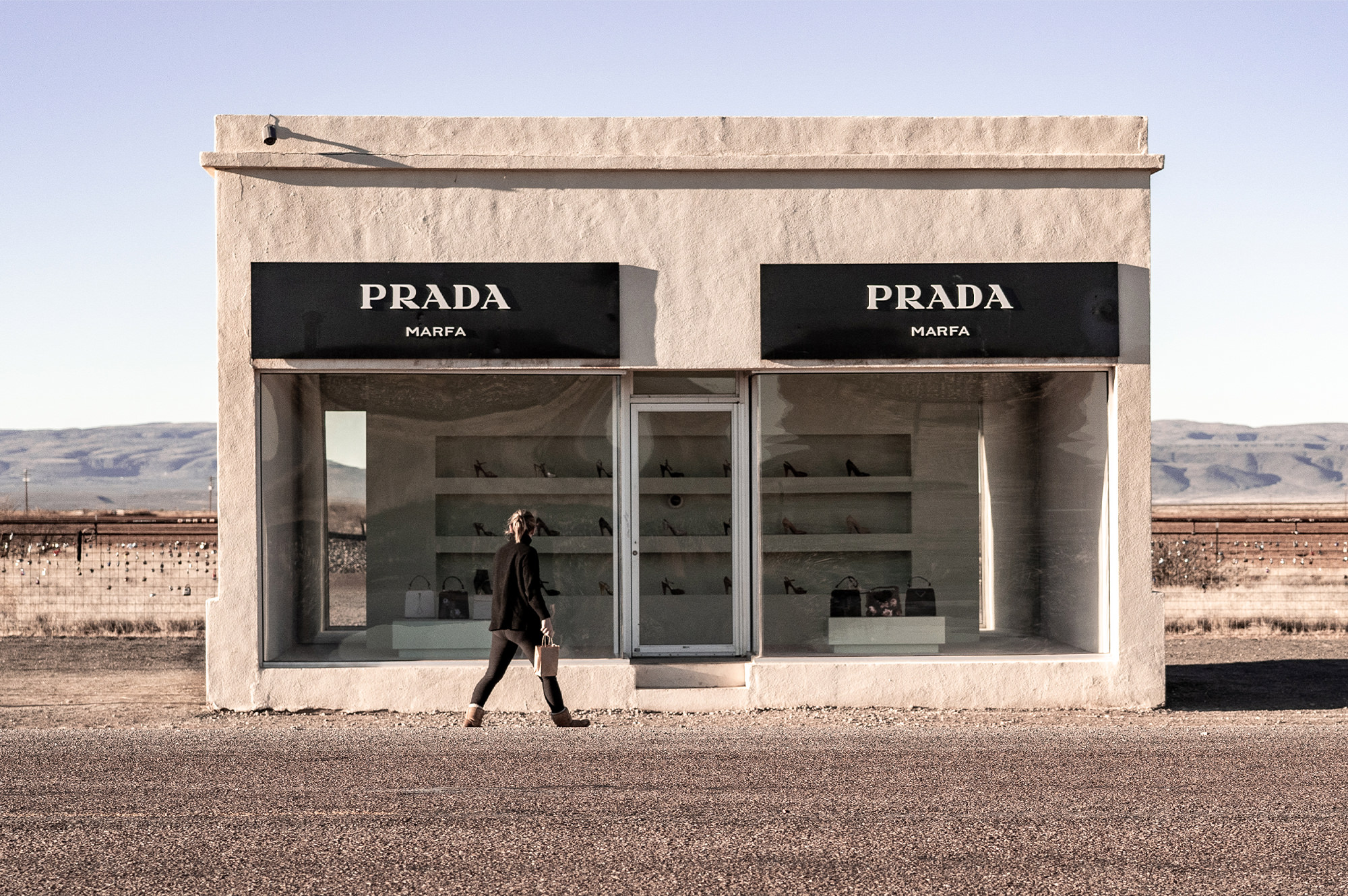 Woman in front of Prada store