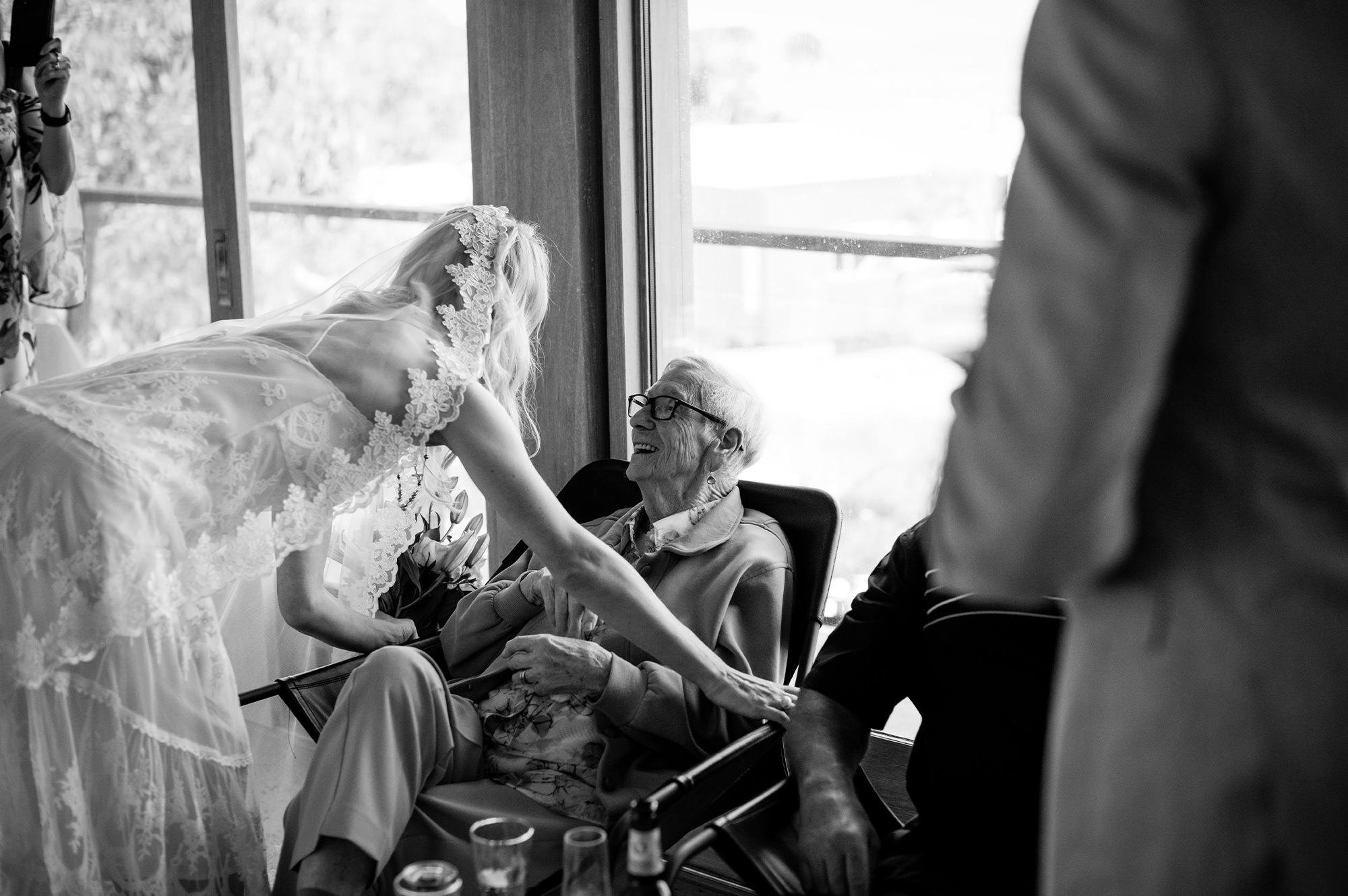 Bride speaking with elderly man