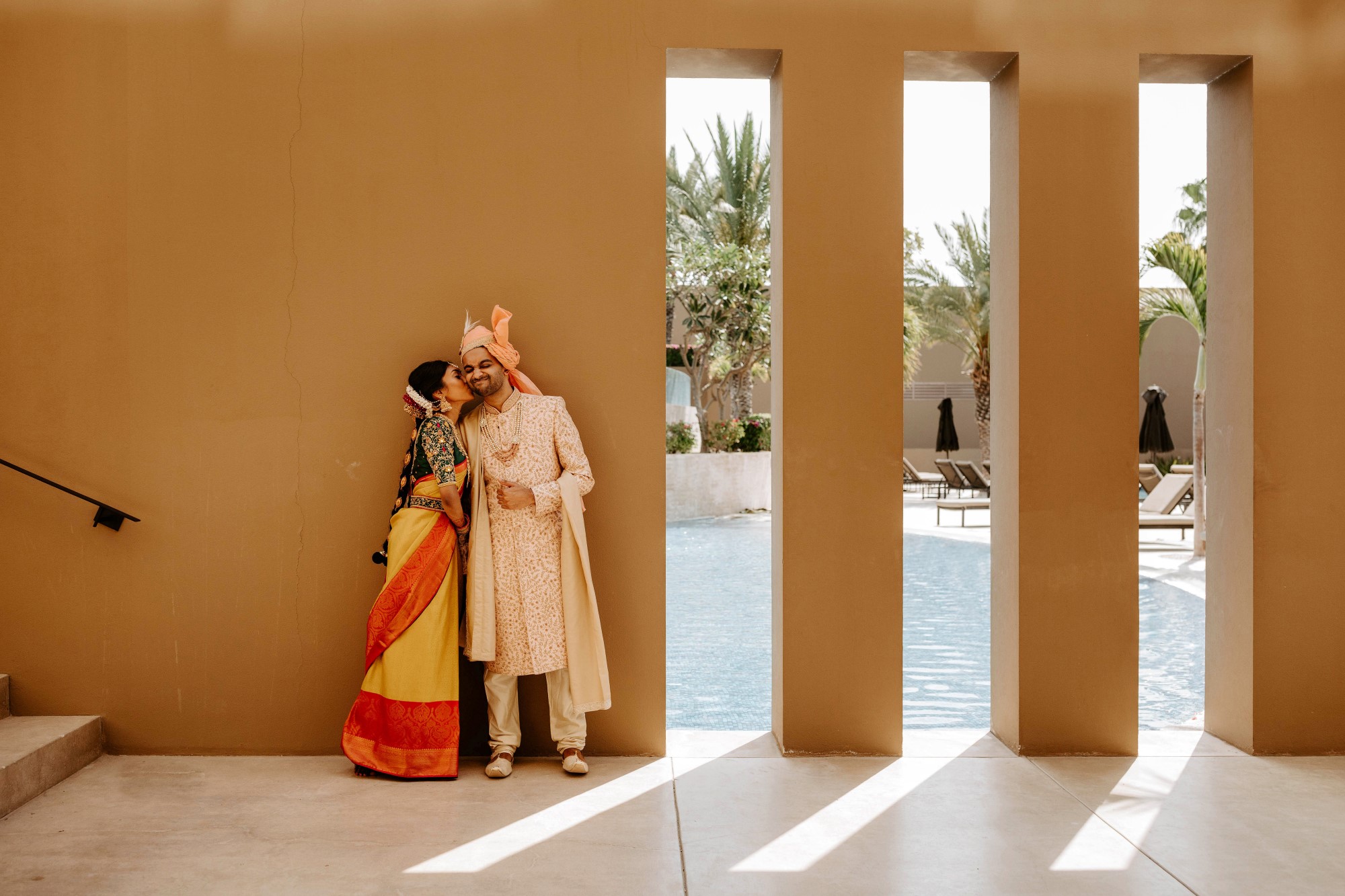 Bride kissing groom on cheek