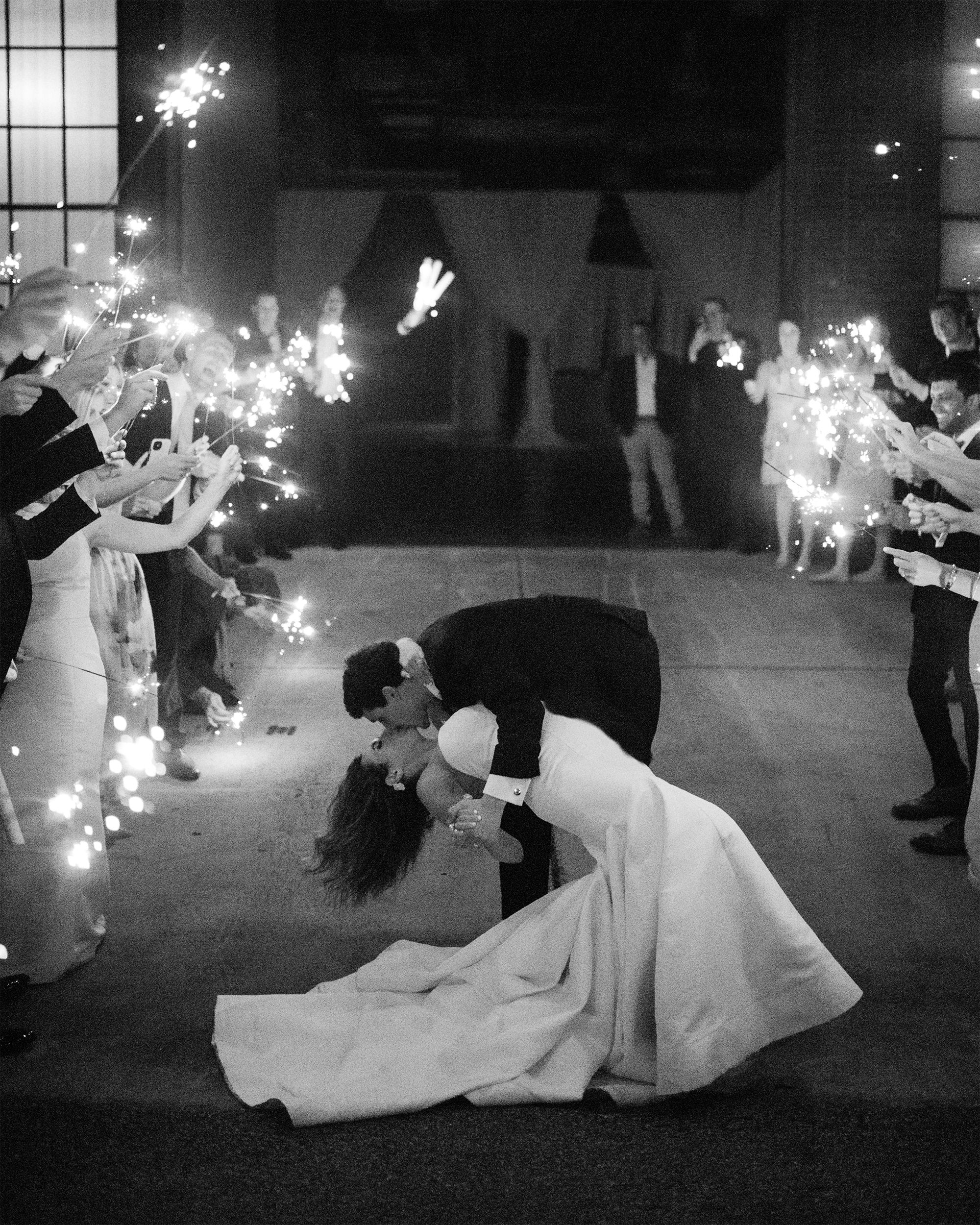 Newlyweds share kiss among guests