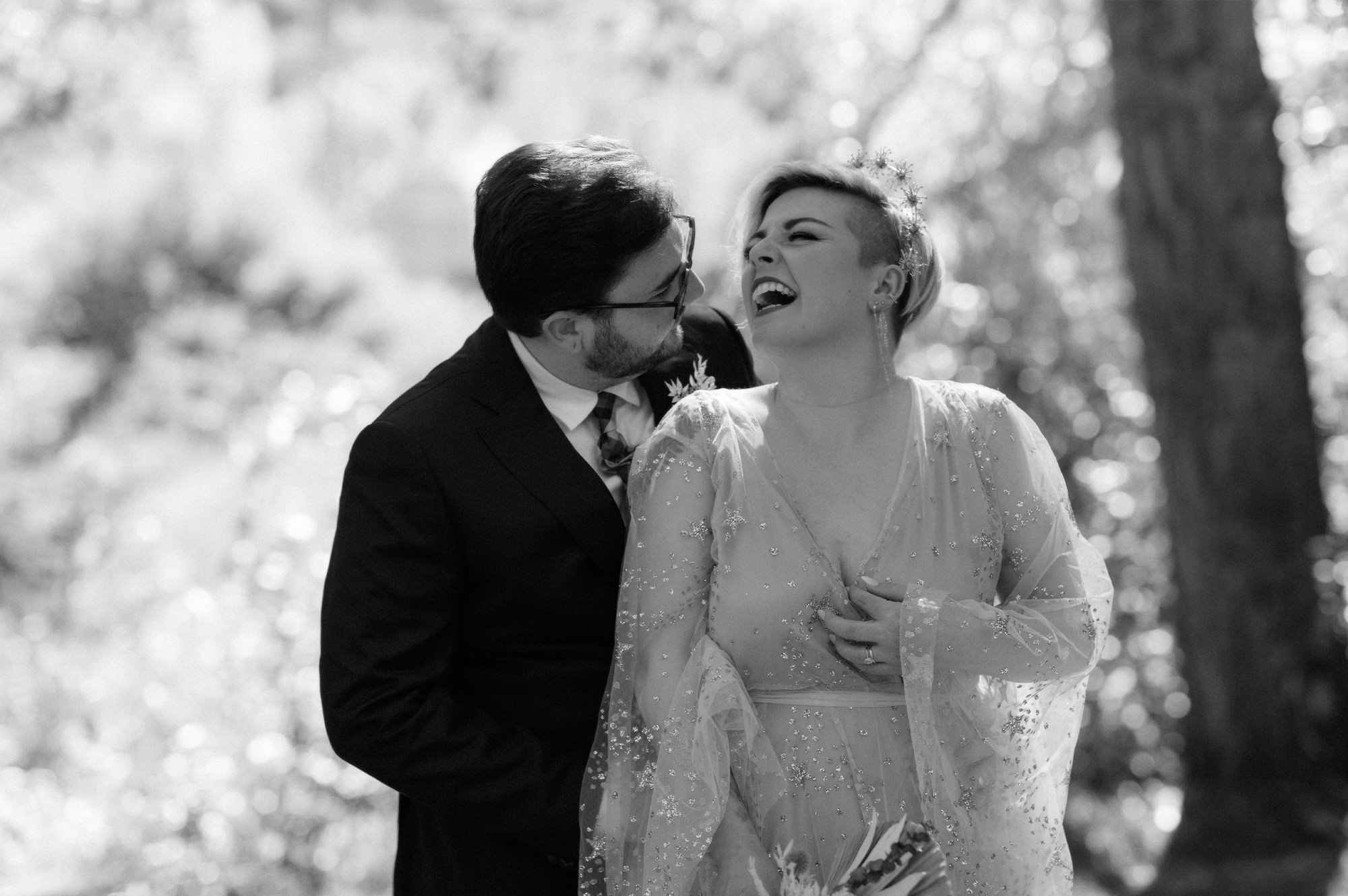 Bride and groom laughing together