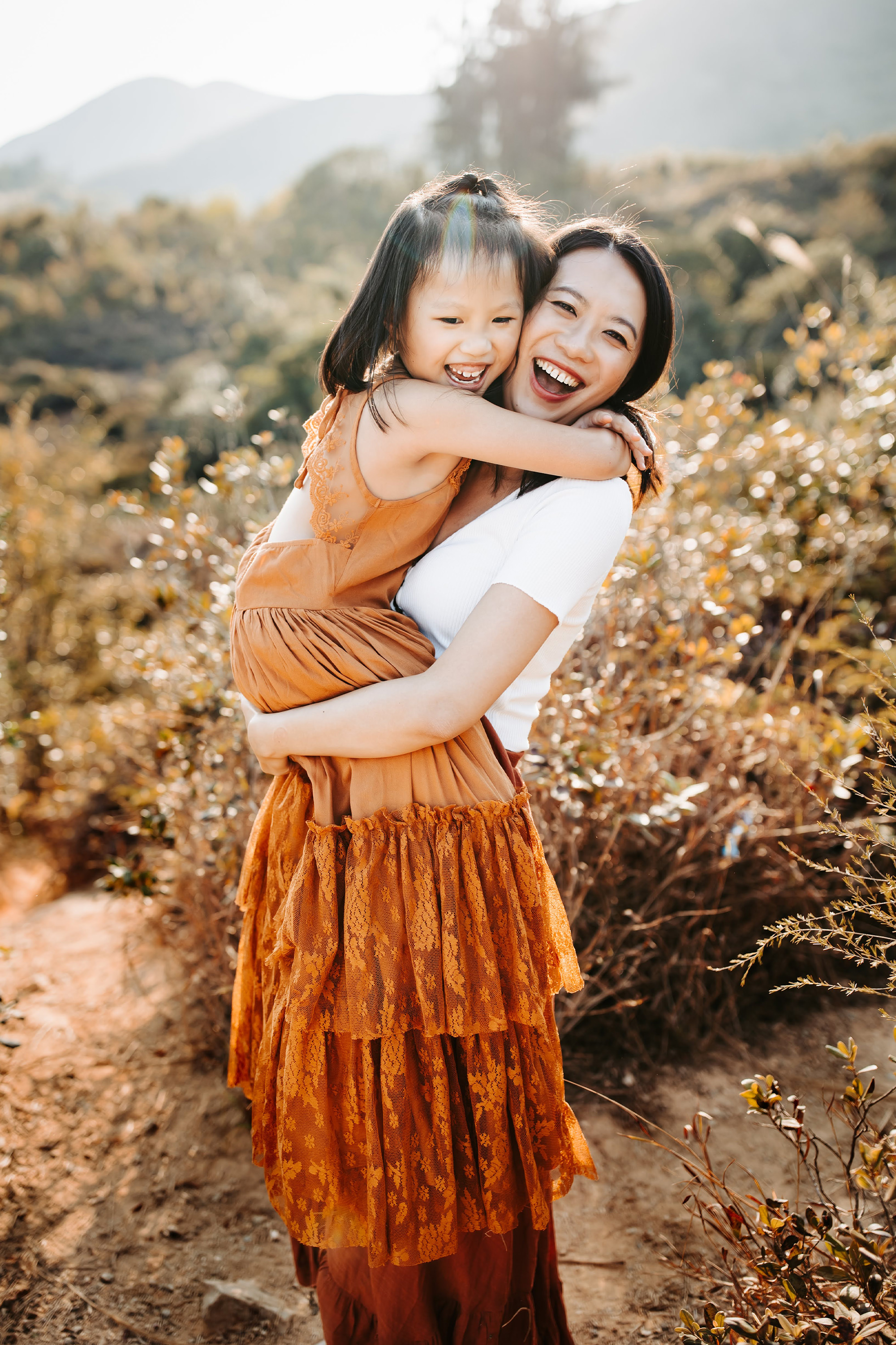Woman and child hugging and smiling