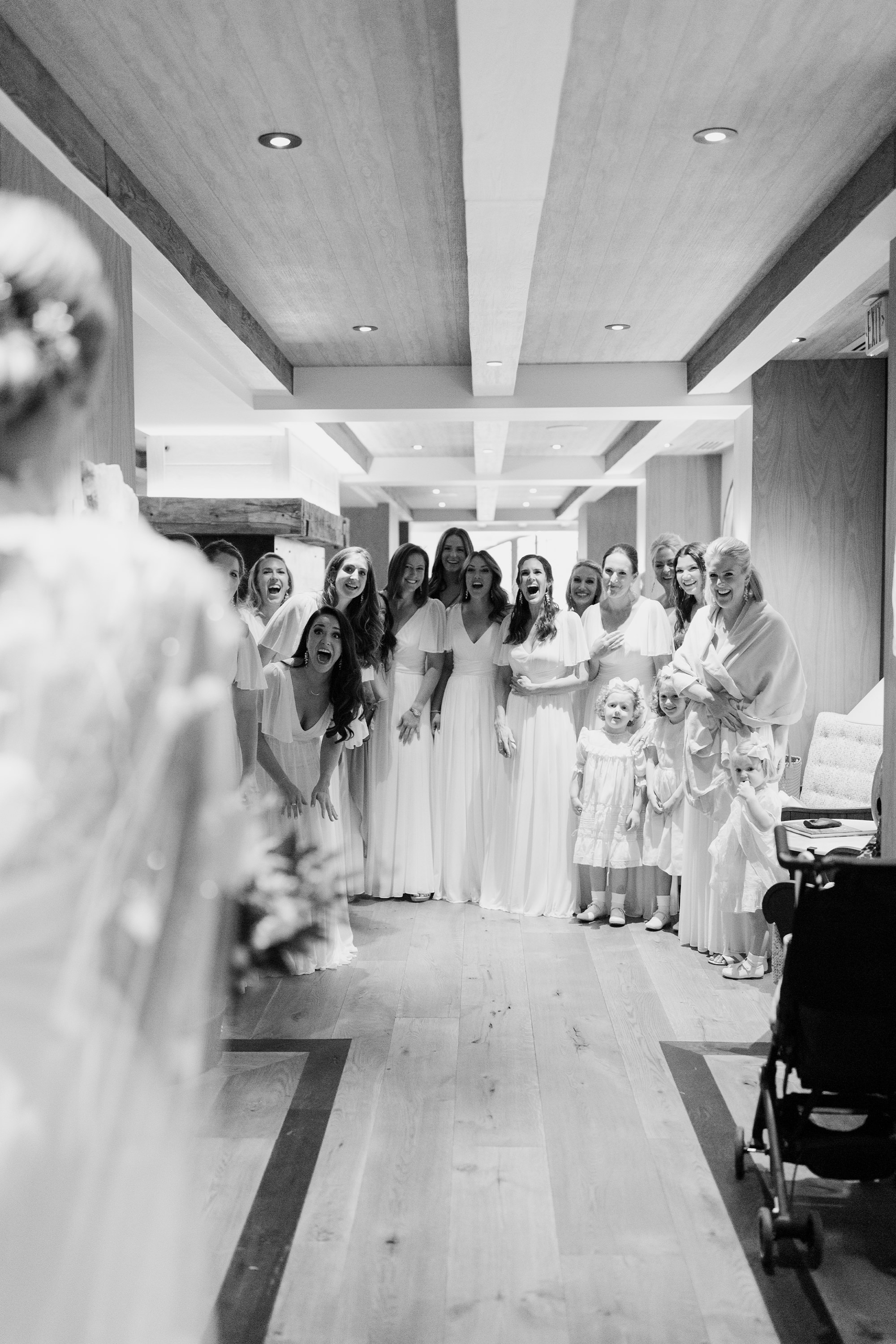 Bridal party admiring bride