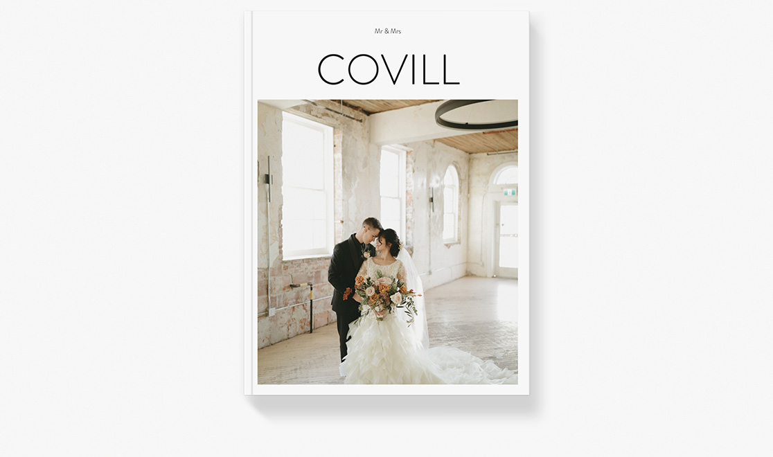 Wedding magazine displaying newlyweds posing for portrait.