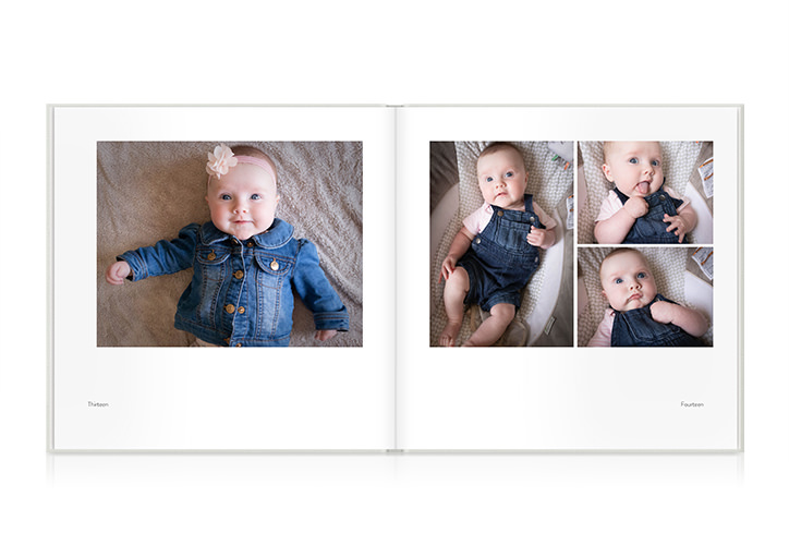 Open photo book showing spread of baby photos