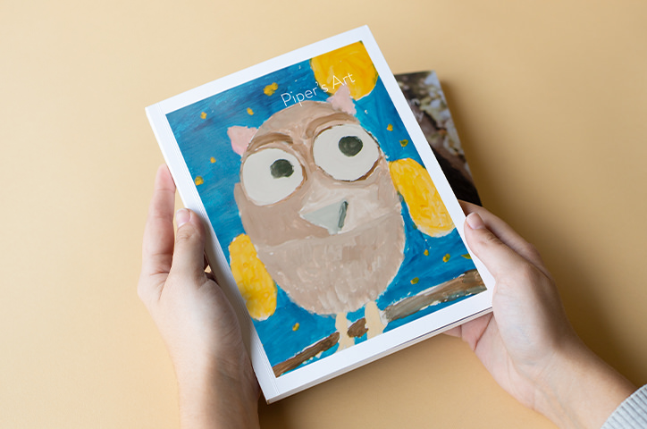 Softcover photo book with child's art on cover