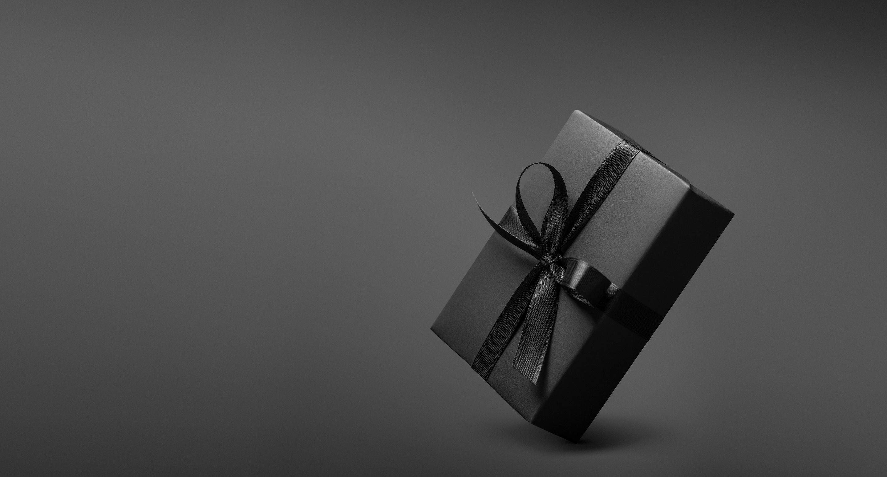 Black gift box with black ribbon