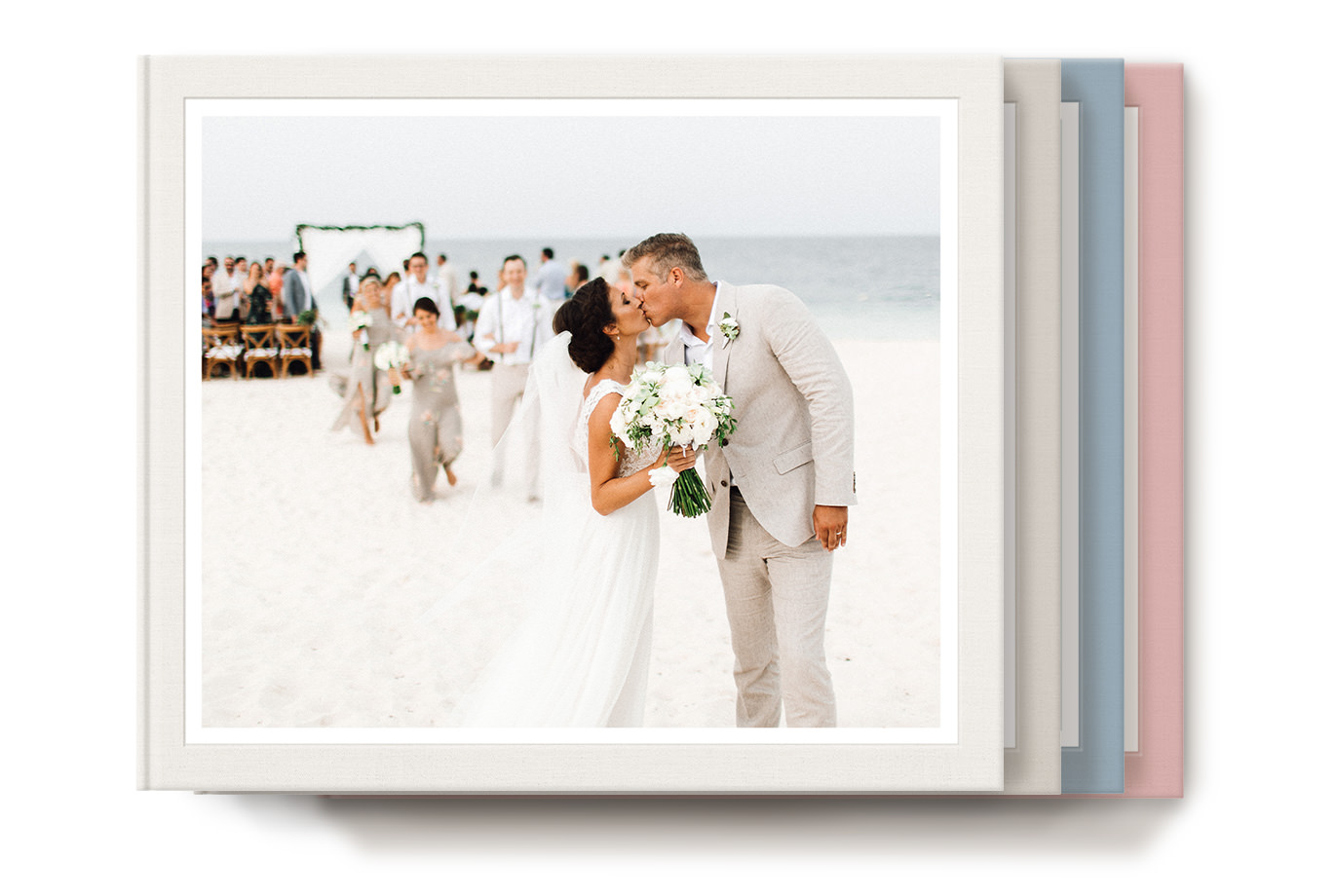 Stack of four classic photo albums showing fabric range. Cover image of a bride and groom on their wedding day