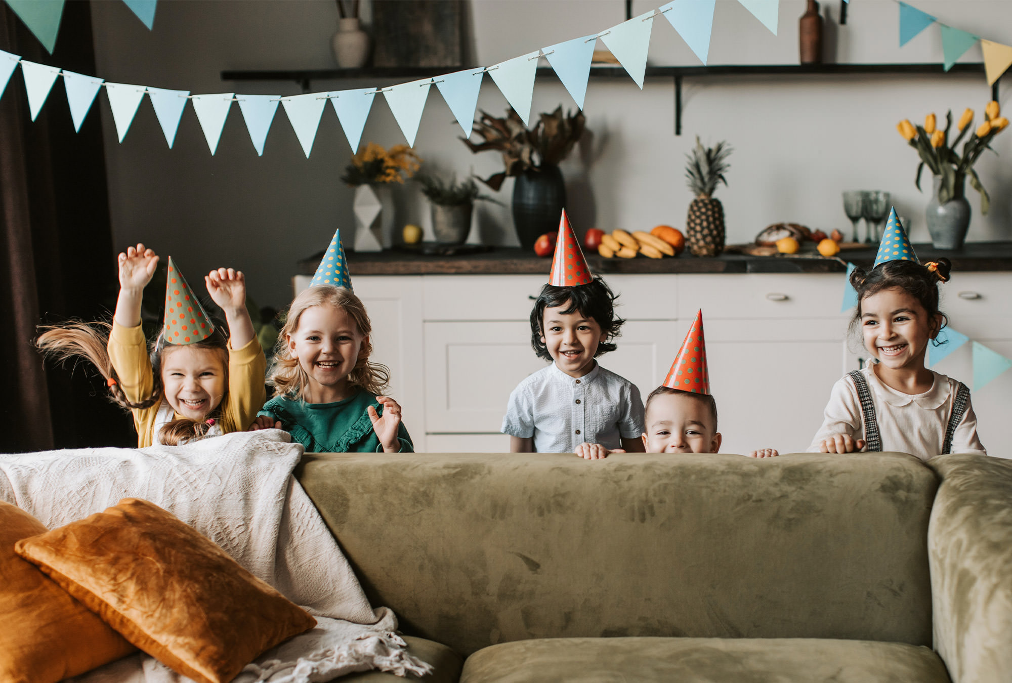 Five children in party hats