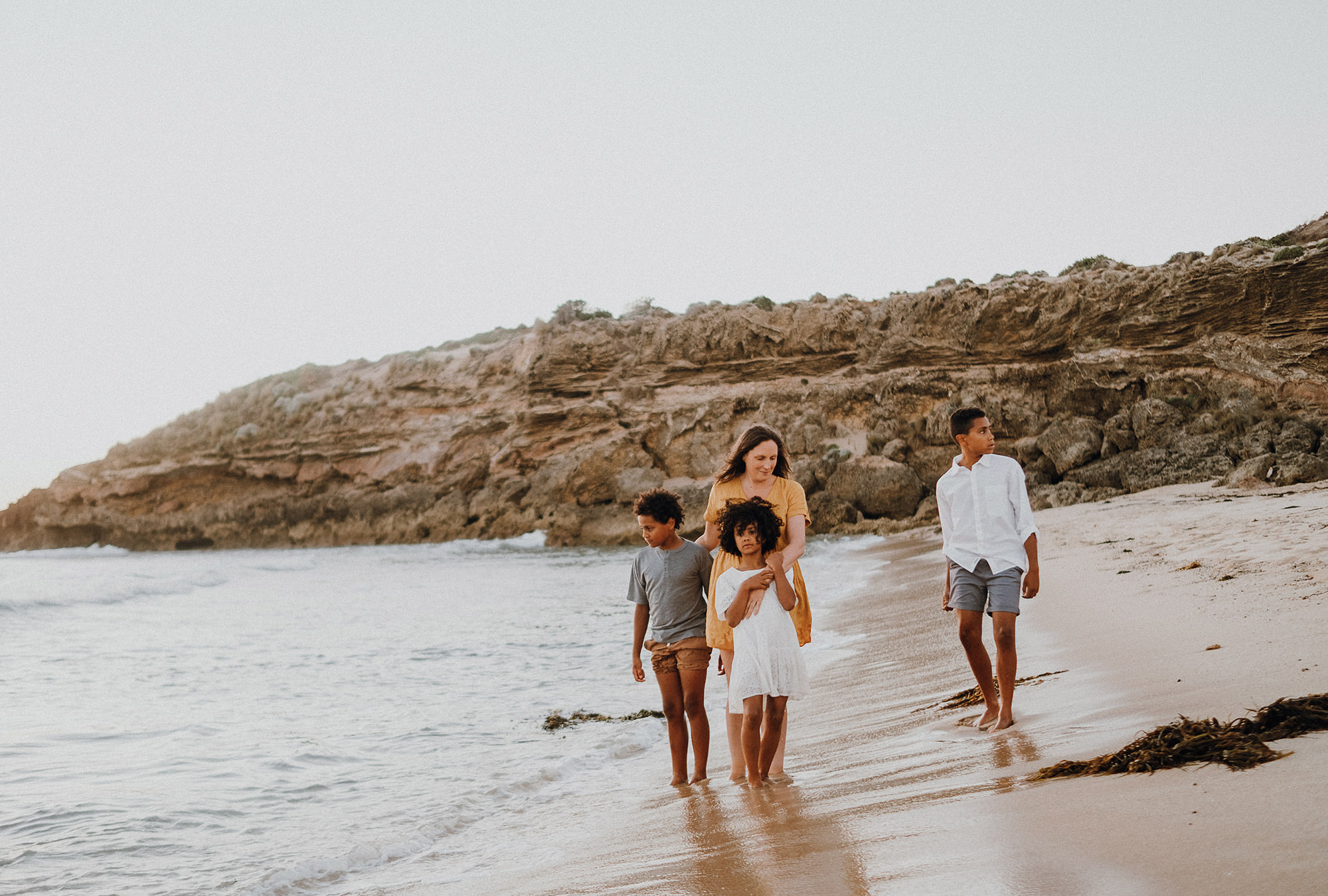 Family of four on beach