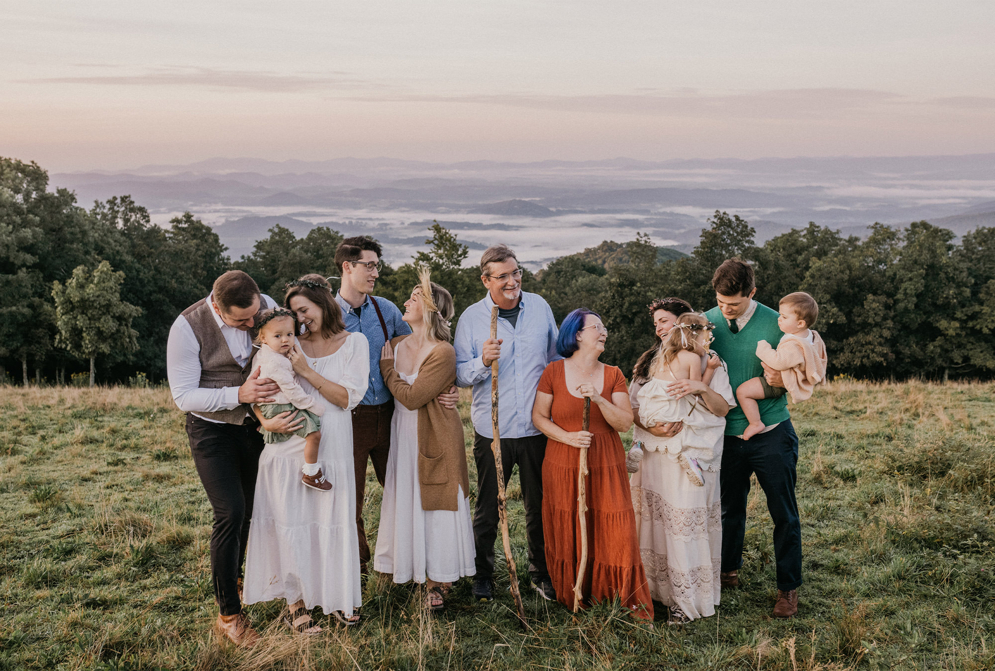 Family of eleven together on a hill