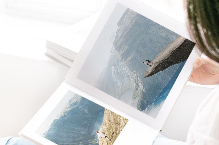 Open photo book with travel photo