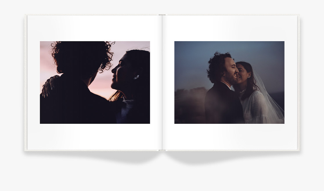 Wedding photo of couple in front of sunset sky