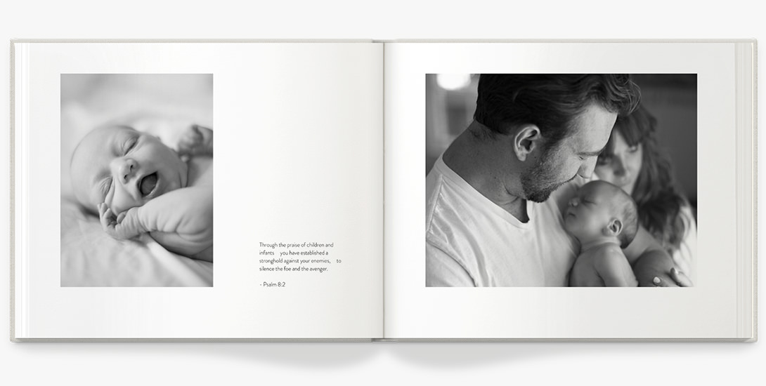 Open photo book with newborn photography.