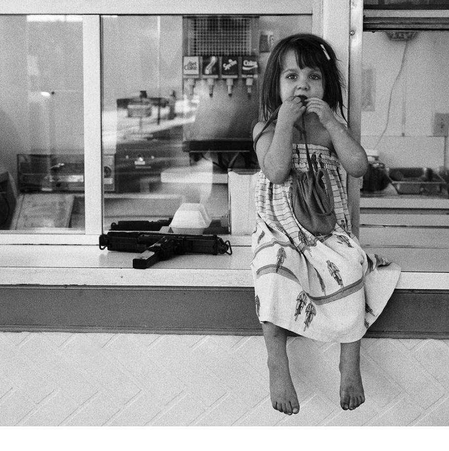 Girl with an Uzi taken at the hamburger stand opposite the Alley rehearsal studios in North Hollywood, 1998.