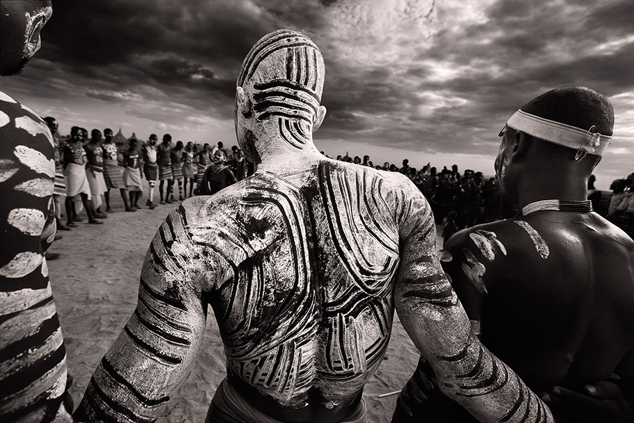 Karo Tribesmen Dancing, Wearing White Chalk Body Paint, Omo Delta, Ethiopia.