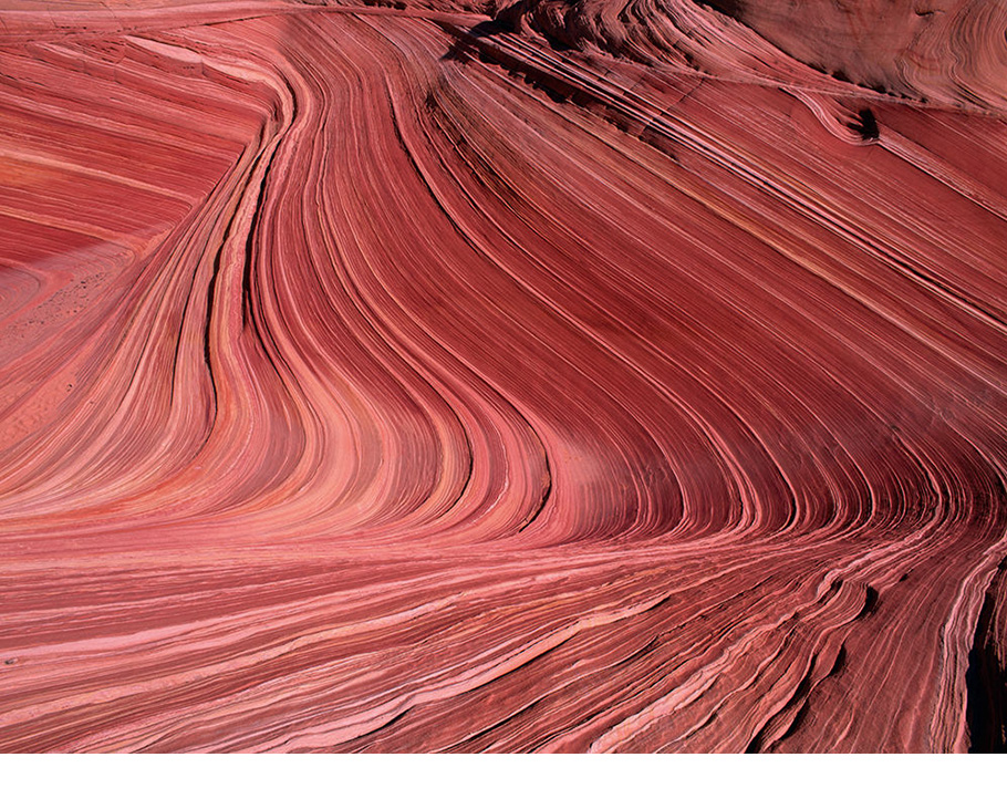 Art Wolfe photography of red desert landscape.