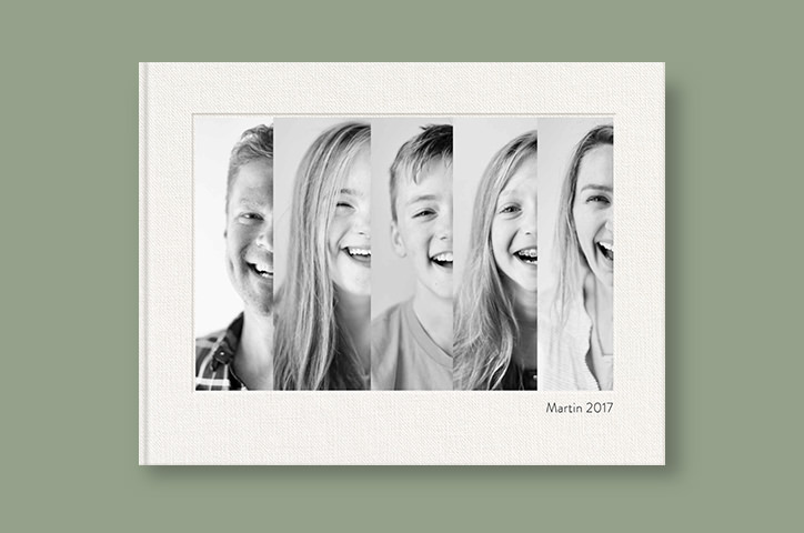 Photo book showing family of five on cover