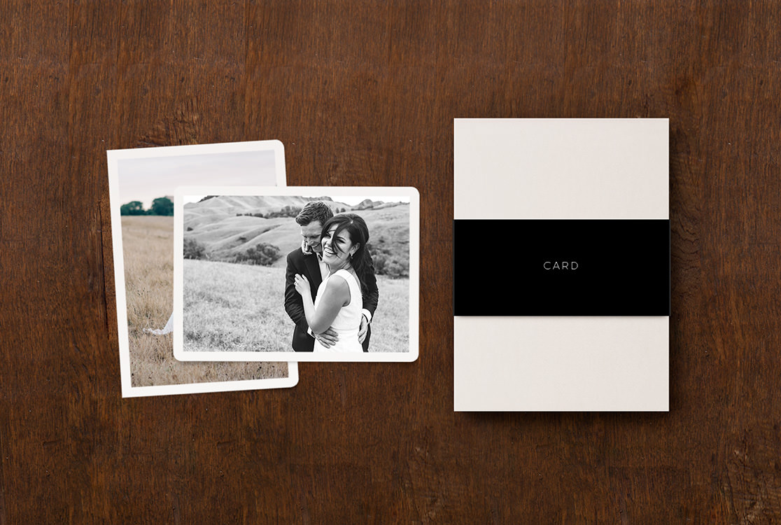 Two wedding thank you cards next to the box.