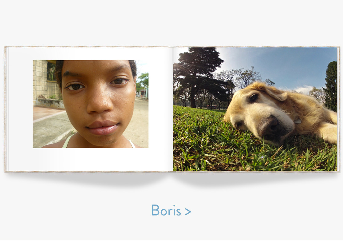 Open photo book with closeup image of a person and a dog.