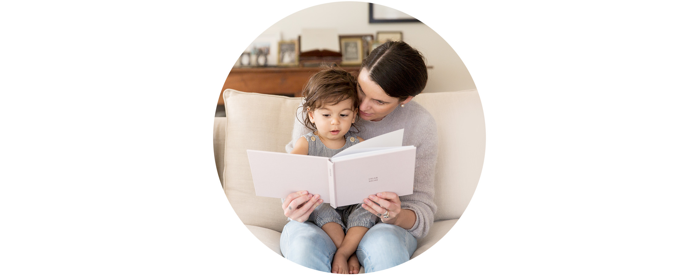Woman and child flip through photo book together
