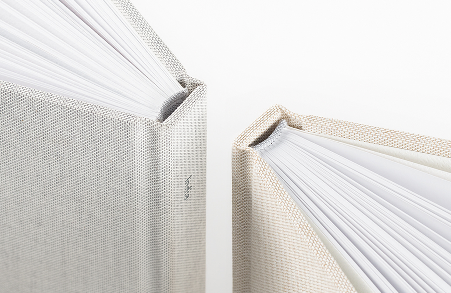 Closeup, top-down view of photo book section-sewn binding.