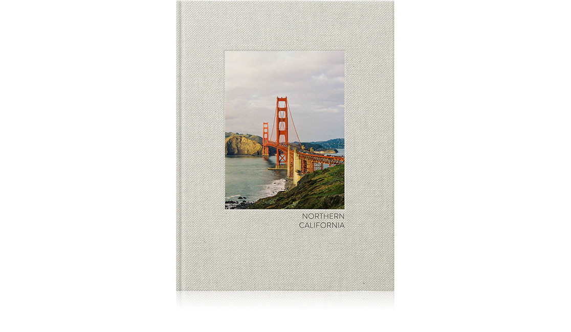 Travel photo book with image of bridge on cover.