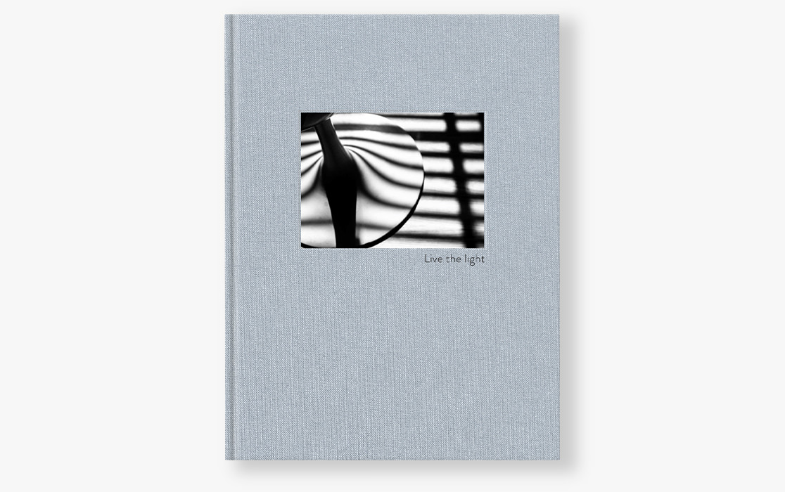 Photo book with black and white photography on the cover.