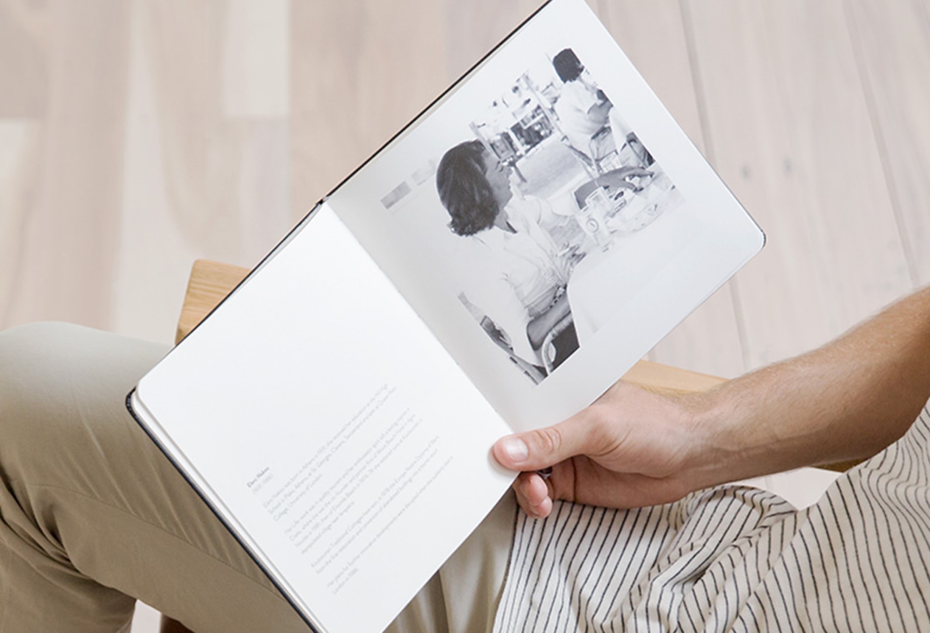 Male holding open Moleskine Photo Book