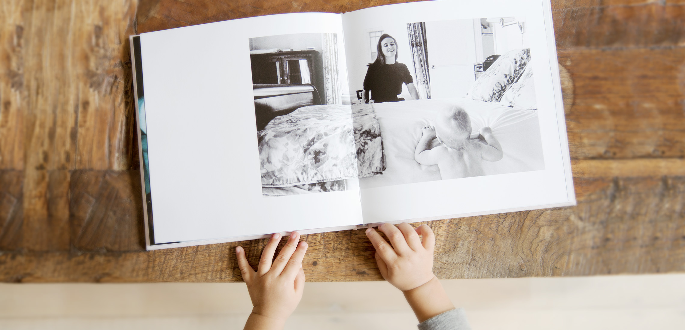 Open photo book on coffee table