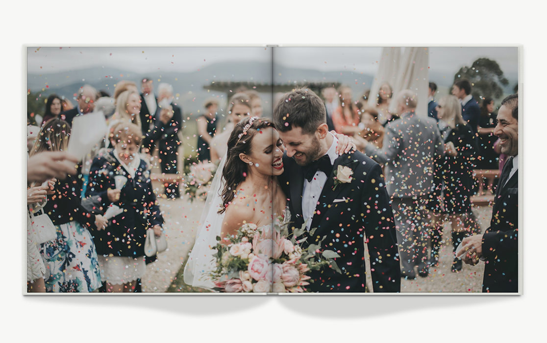Photo book with newlyweds covered in confetti