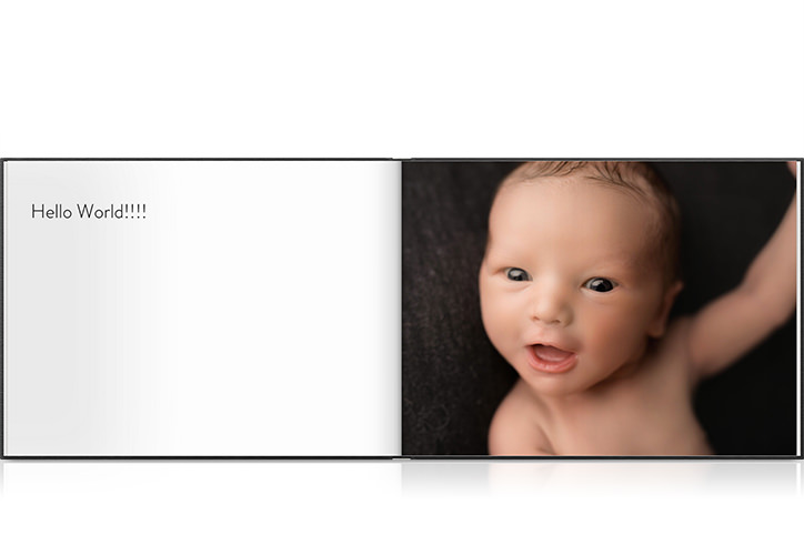 Livro fotográfico de paisagem do bebê aberto com a foto de um bebê.